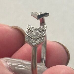 White gild and diamonds ring.